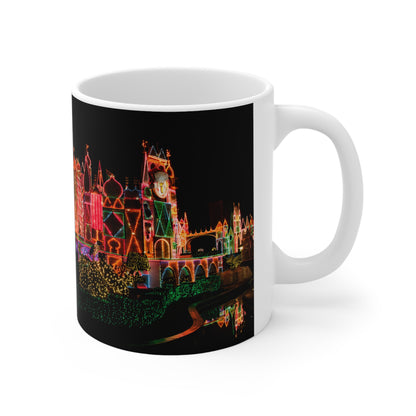 Disneyland It's a Small World Taken at night Ceramic Mug — Festive Neon Christmas Coffee Cup (11oz & 15oz)