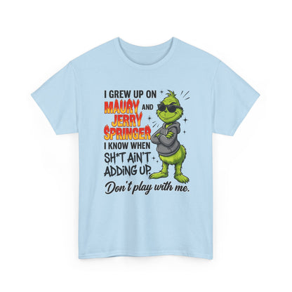 Grinch Cartoon Tee — "I Grew Up on Maury and Jerry Springer" Funny Holiday Shirt