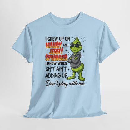 Grinch Cartoon Tee — "I Grew Up on Maury and Jerry Springer" Funny Holiday Shirt